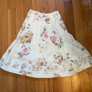 White floral mid length skirt. Two Star Dog brand XS. No tags, but never worn!